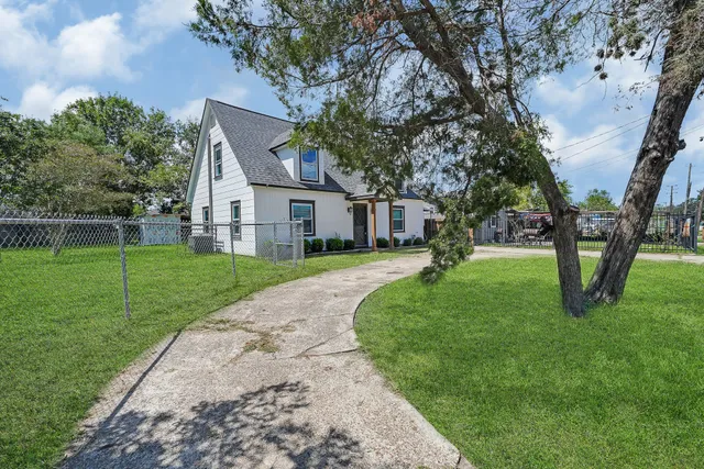 a house with garden in front of it