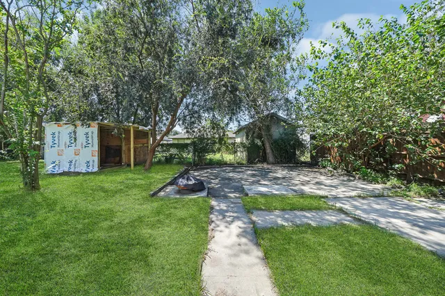 a view of backyard with green space