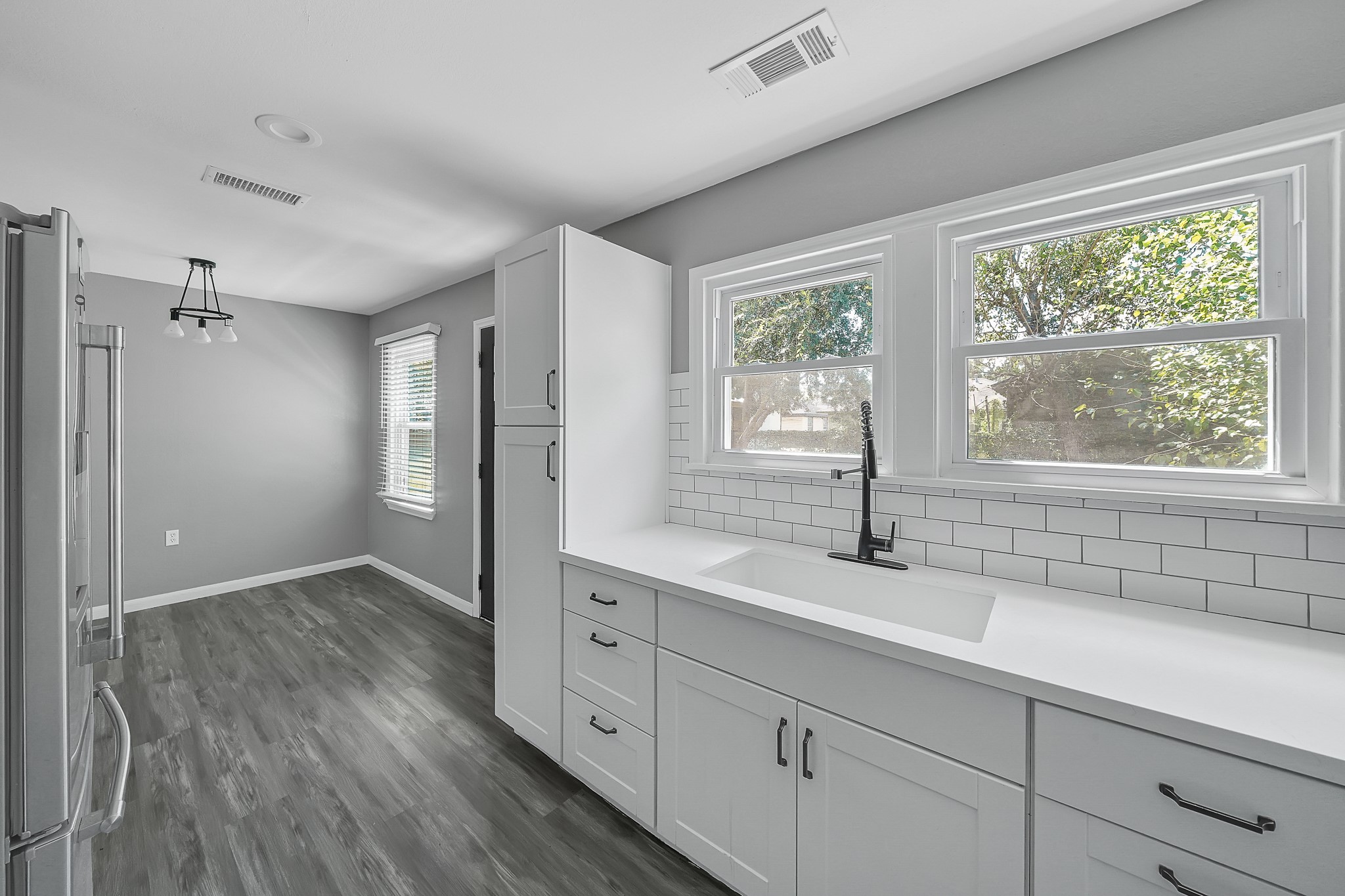 7323 Farnsworth Street Houston, TX 77022 - Photo 10 of 23 a kitchen with sink and windows