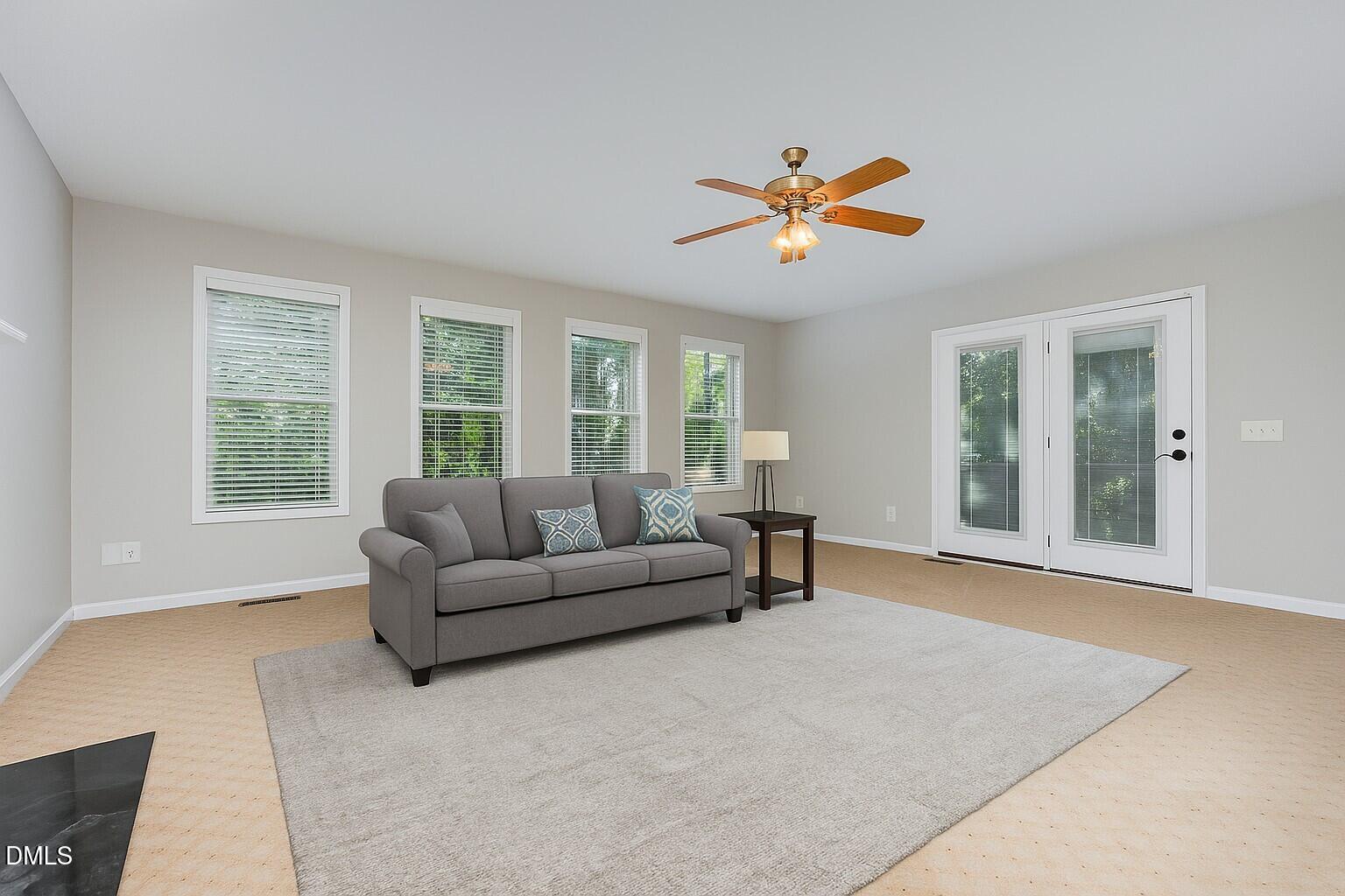637 Coachman Way Sanford, NC 27332 - Photo 12 of 26 a living room with furniture and a large window