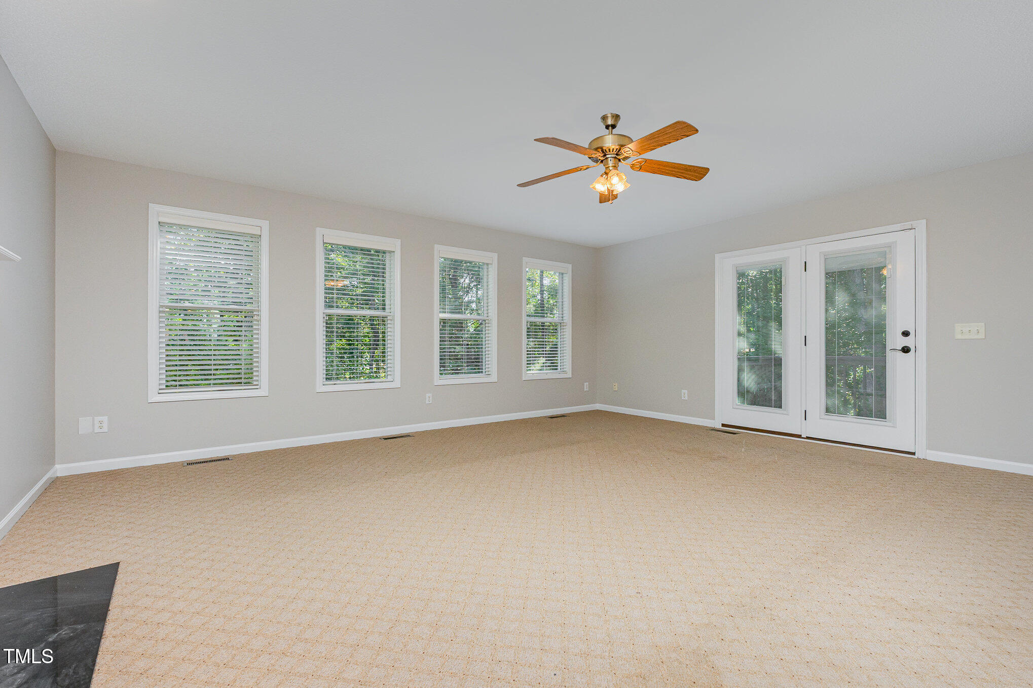 637 Coachman Way Sanford, NC 27332 - Photo 13 of 26 wooden floor in an empty room with a window
