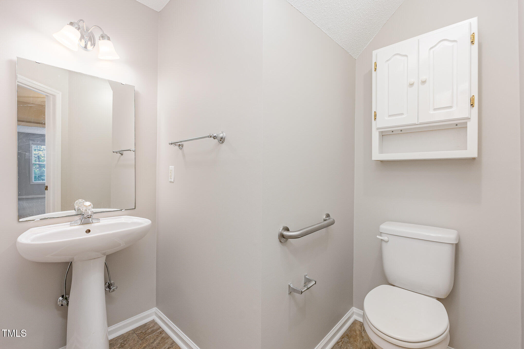 637 Coachman Way Sanford, NC 27332 - Photo 15 of 26 a bathroom with a toilet sink and mirror