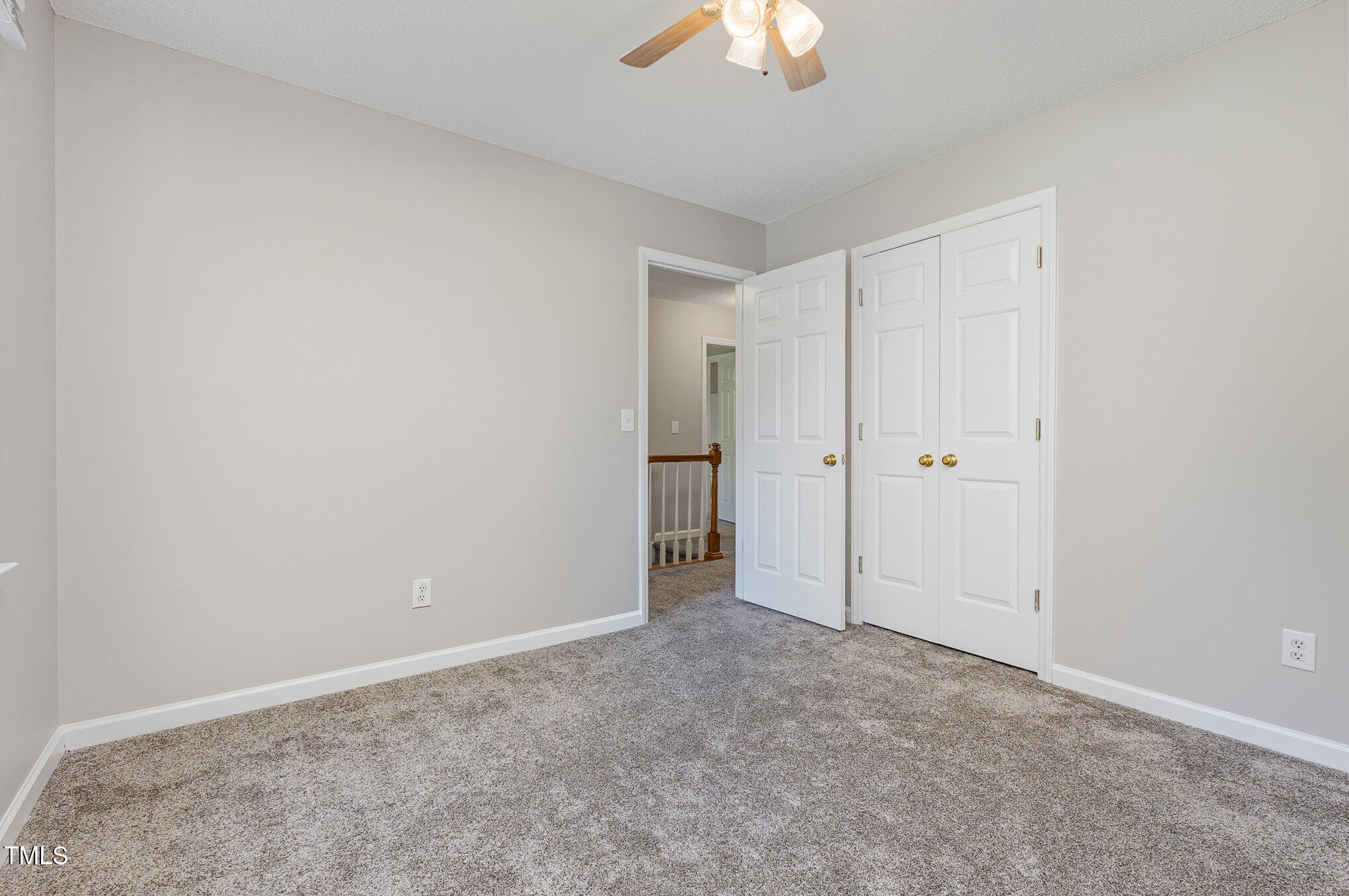 637 Coachman Way Sanford, NC 27332 - Photo 20 of 26 a view of an empty room with a chandelier fan
