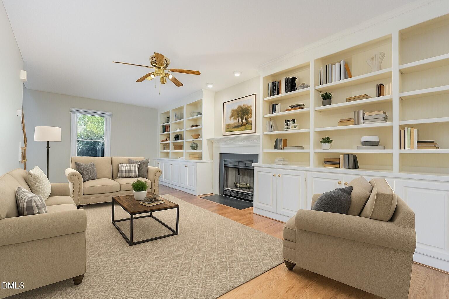 637 Coachman Way Sanford, NC 27332 - Photo 2 of 26 a living room with furniture a fireplace and a large window