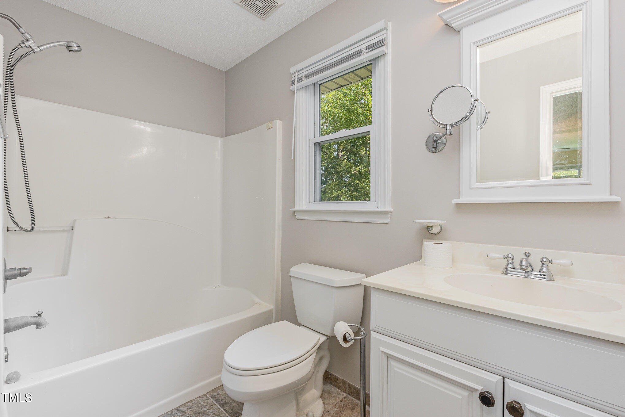 637 Coachman Way Sanford, NC 27332 - Photo 21 of 26 a bathroom with a sink toilet a mirror and shower