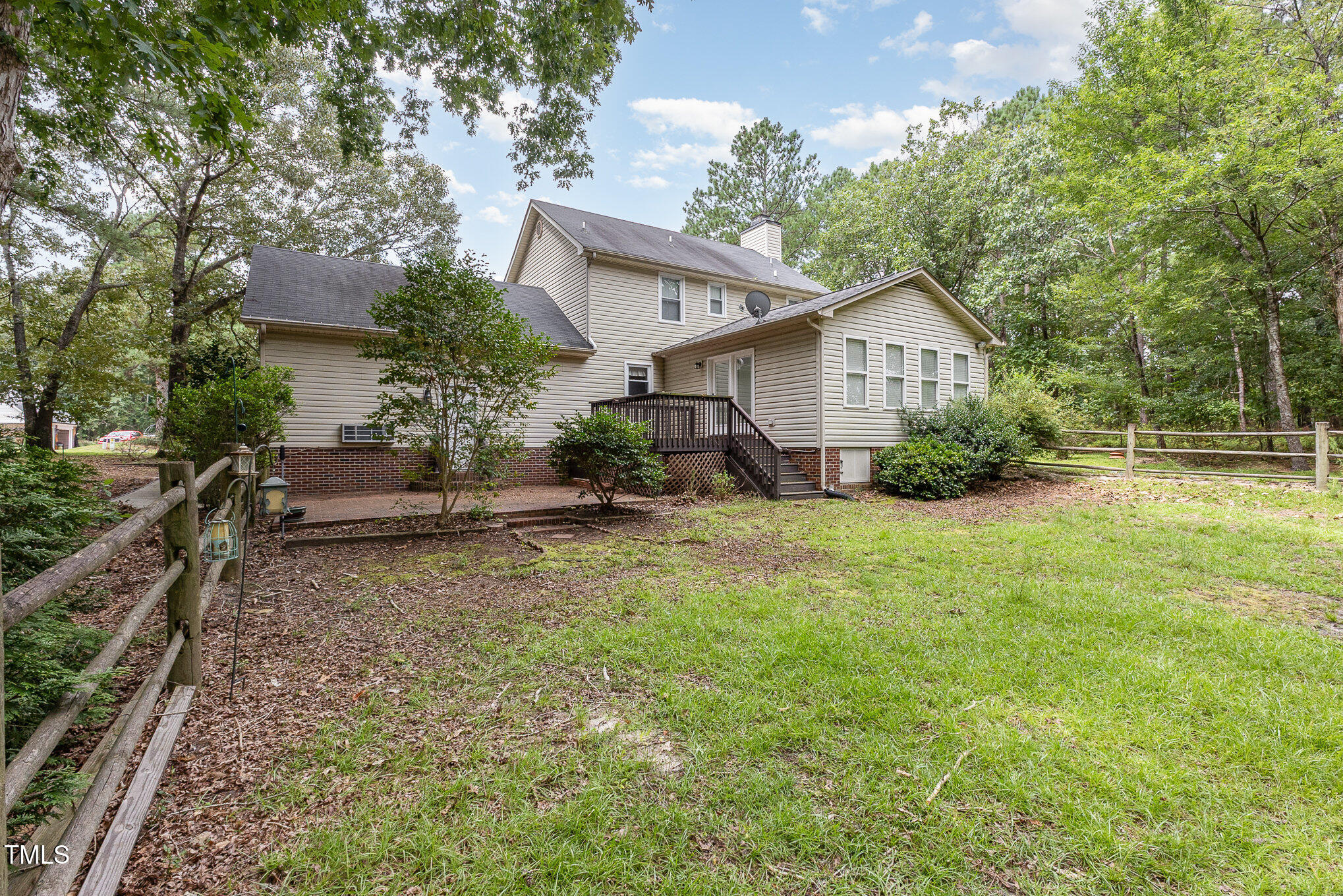 637 Coachman Way Sanford, NC 27332 - Photo 26 of 26 a view of a house with yard and a garden