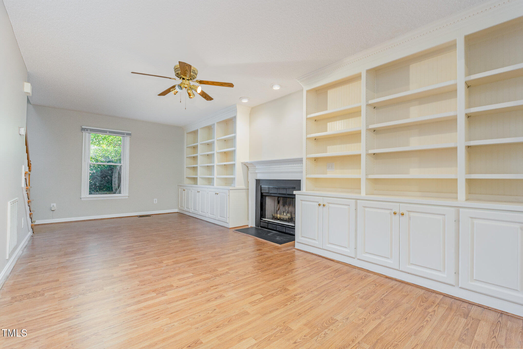 637 Coachman Way Sanford, NC 27332 - Photo 5 of 26 a view of an empty room with a window and a kitchen