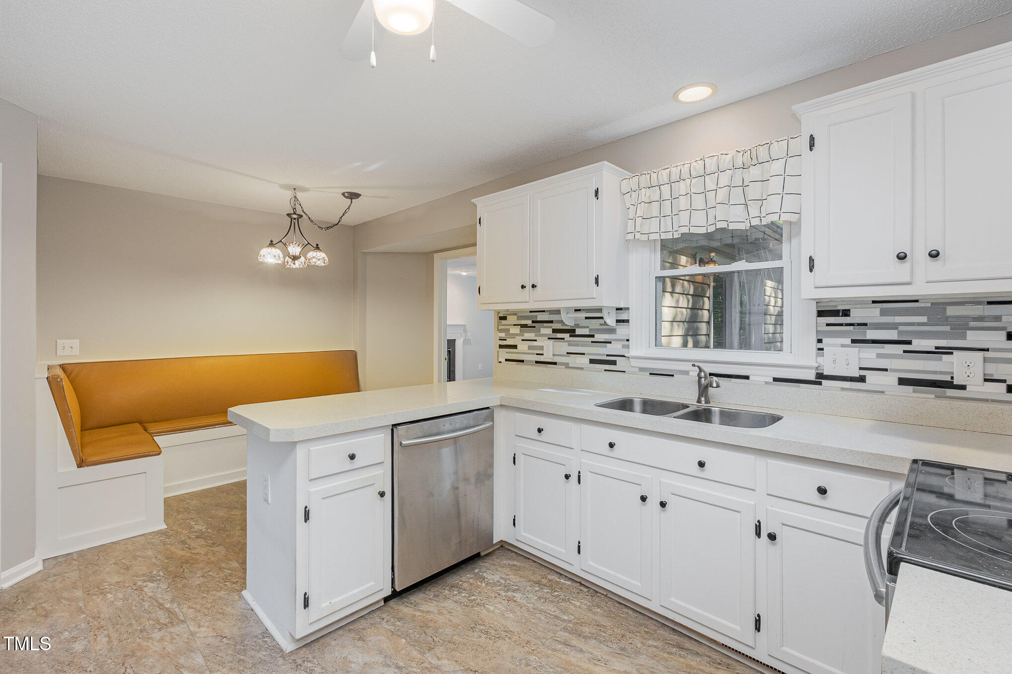 637 Coachman Way Sanford, NC 27332 - Photo 6 of 26 a kitchen with stainless steel appliances kitchen island granite countertop a sink a stove and cabinets