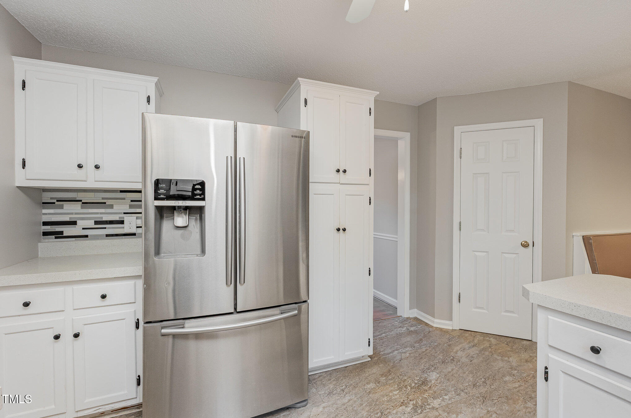 637 Coachman Way Sanford, NC 27332 - Photo 9 of 26 a kitchen with stainless steel appliances white cabinets and a refrigerator