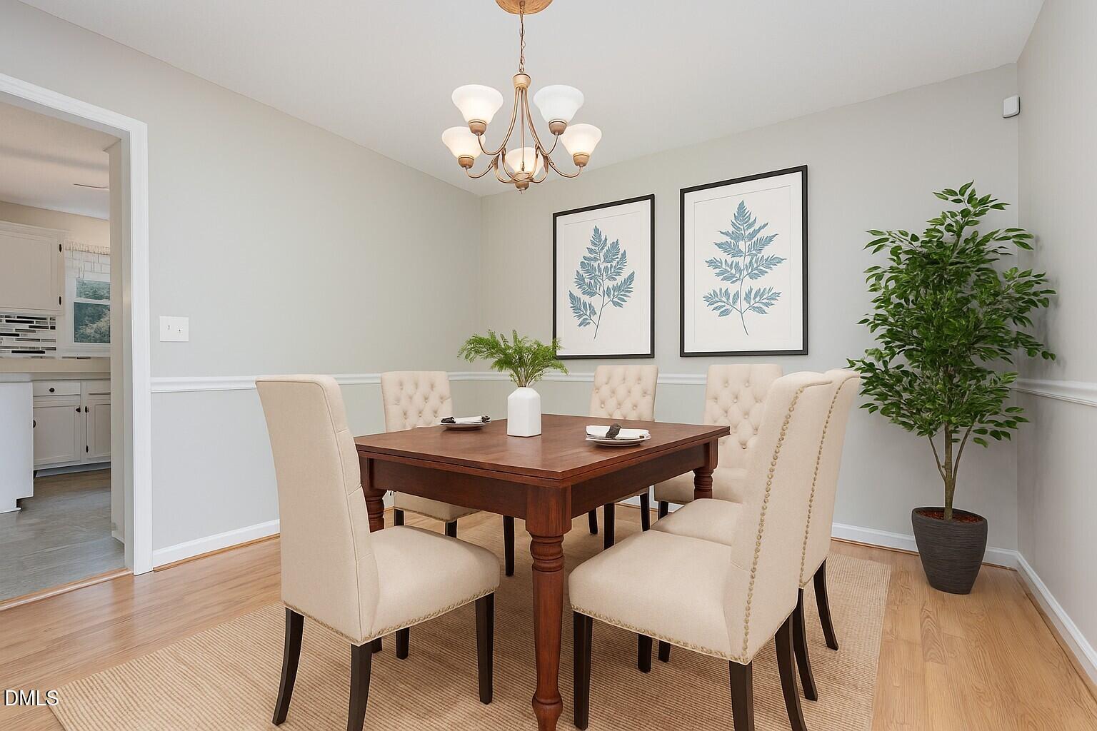 637 Coachman Way Sanford, NC 27332 - Photo 10 of 26 a view of a dining room with furniture and wooden floor