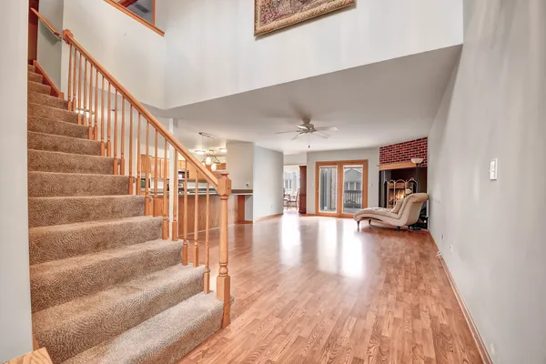 a view of entryway and hall with wooden floor
