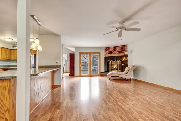 a view of living room with furniture and a fireplace