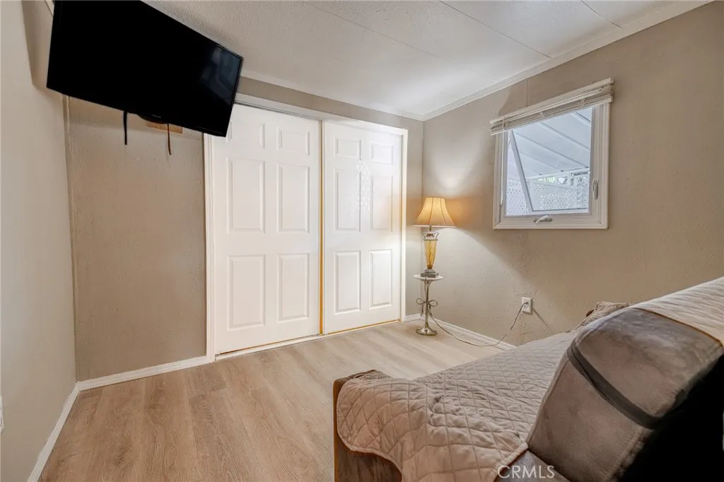 9340 Foothill, Unit 68 Rancho Cucamonga, CA 91730 - Photo 11 of 30 a bedroom with a bed and a window