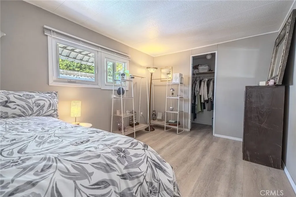 9340 Foothill, Unit 68 Rancho Cucamonga, CA 91730 - Photo 14 of 30 a spacious bedroom with a bed and a dresser