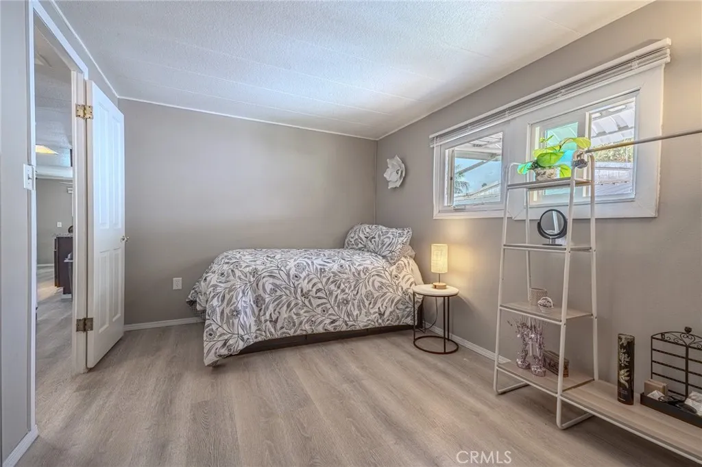 9340 Foothill, Unit 68 Rancho Cucamonga, CA 91730 - Photo 16 of 30 a bedroom with a bed and a window