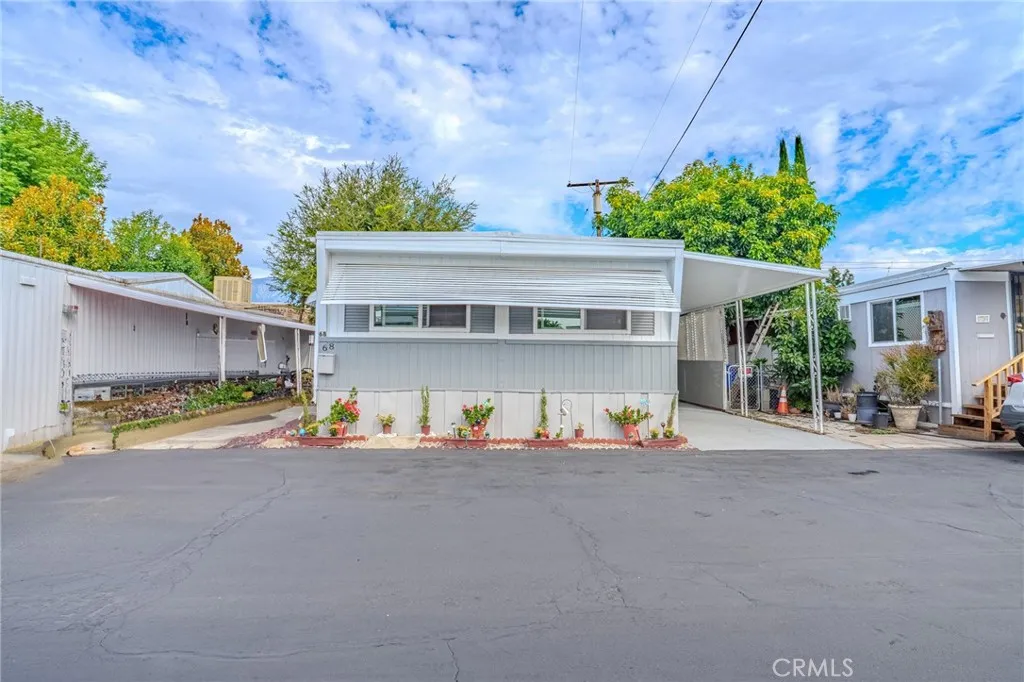 9340 Foothill, Unit 68 Rancho Cucamonga, CA 91730 - Photo 2 of 30 a house with outdoor space