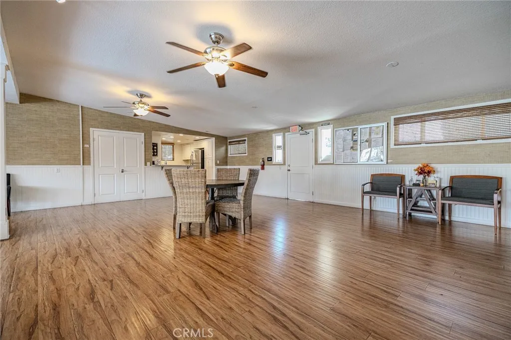 9340 Foothill, Unit 68 Rancho Cucamonga, CA 91730 - Photo 24 of 30 a view of a dining room with furniture and wooden floor