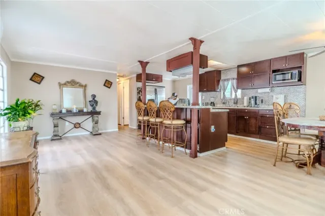 a living room filled with furniture and a chandelier
