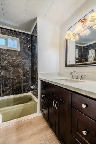 a bathroom with a sink double vanity and a bathtub