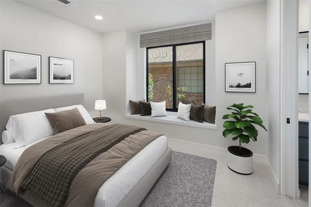 a bedroom with bed and a potted plant