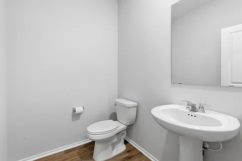 a living room with furniture a potted plant and a window