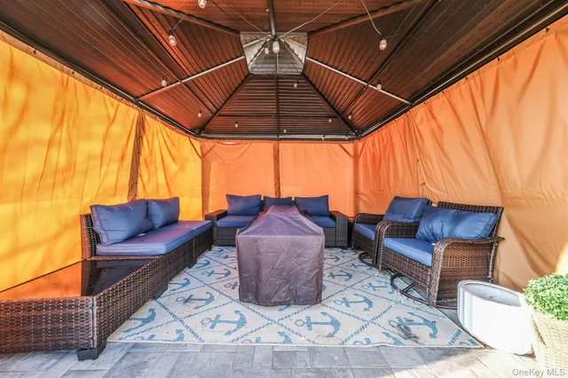 a couch sitting in a room next to a blue chair