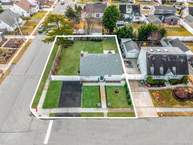 an aerial view of a house with swimming pool