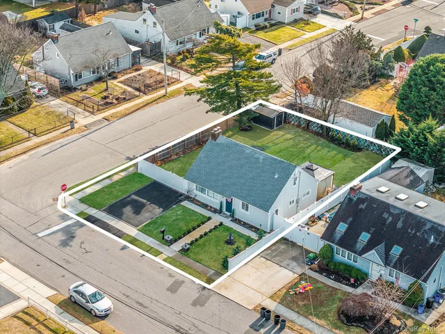 an aerial view of a house with a swimming pool