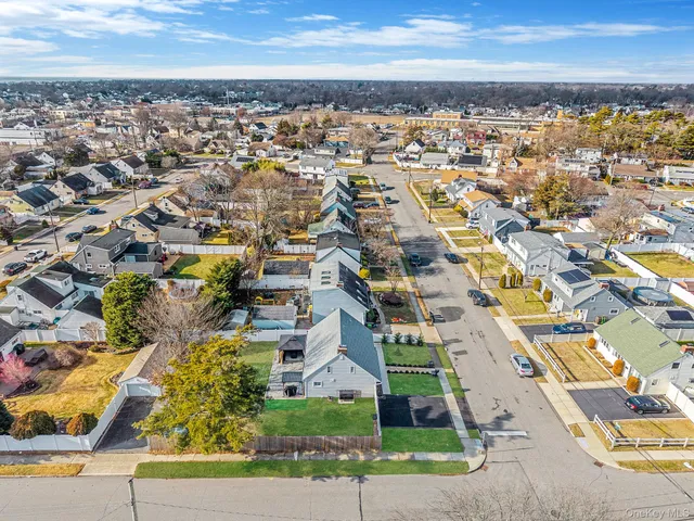 an aerial view of residential building and lake