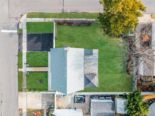an aerial view of a house with a garden