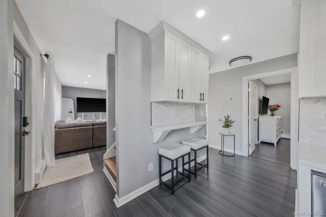 a view of a dining area with furniture and wooden floor