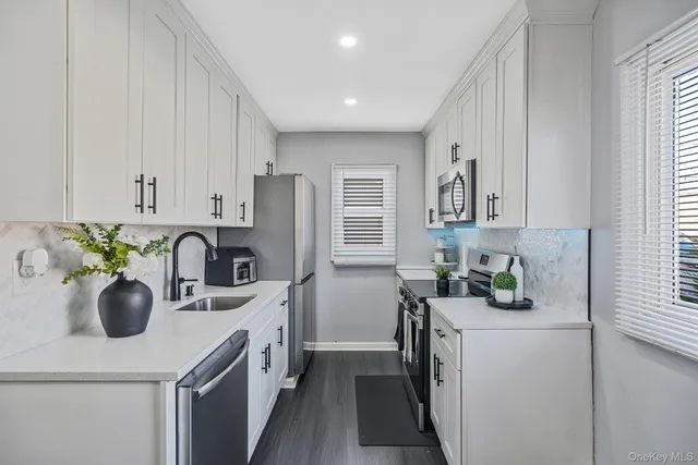 a kitchen with a sink stove and refrigerator