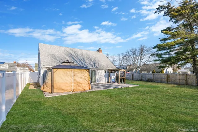 a view of a house with a big yard and garden