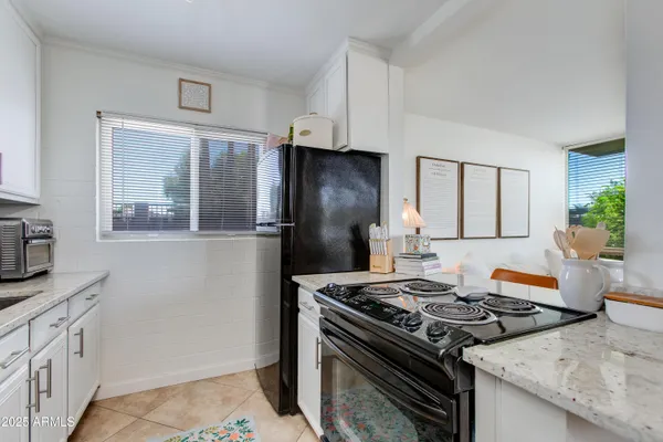 a kitchen with stainless steel appliances a stove and a refrigerator