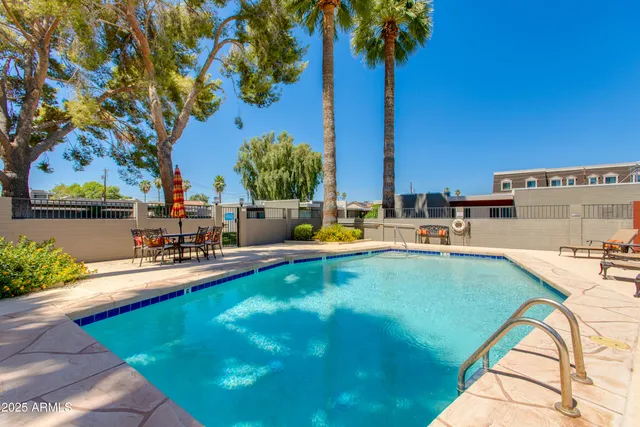 a view of swimming pool with a lounge chair