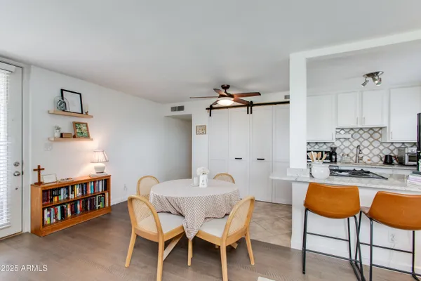 a dining room with furniture and a table