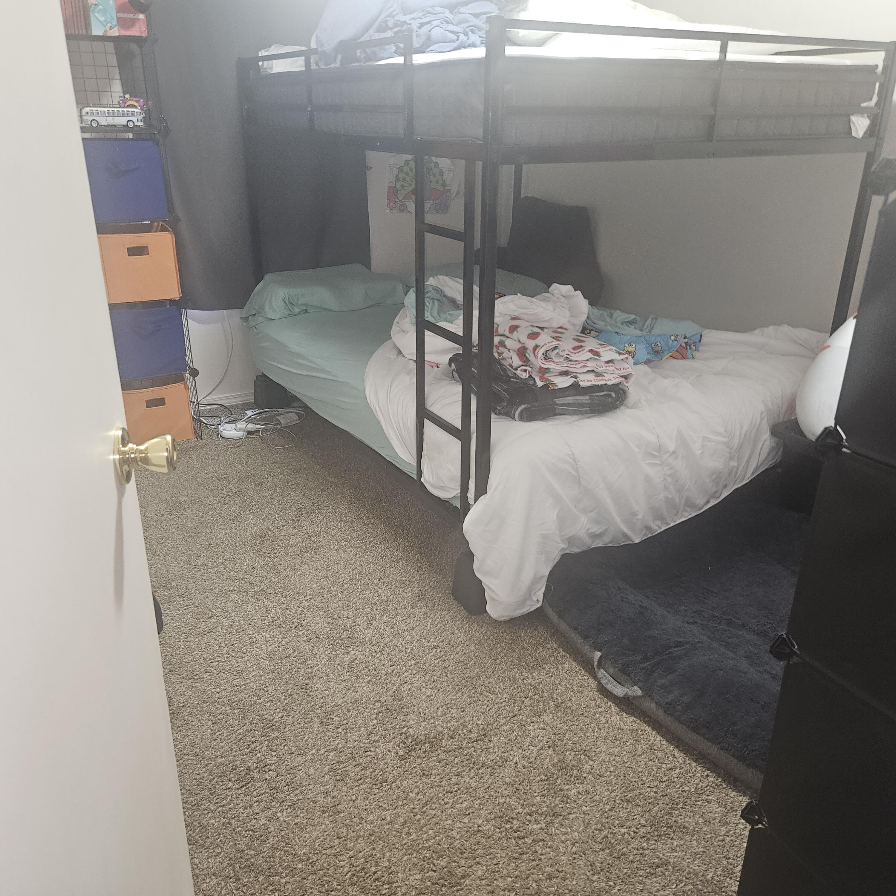 569 Northeast Negus Loop Redmond, OR 97756 - Photo 29 of 32 a bedroom with a bed and lamp