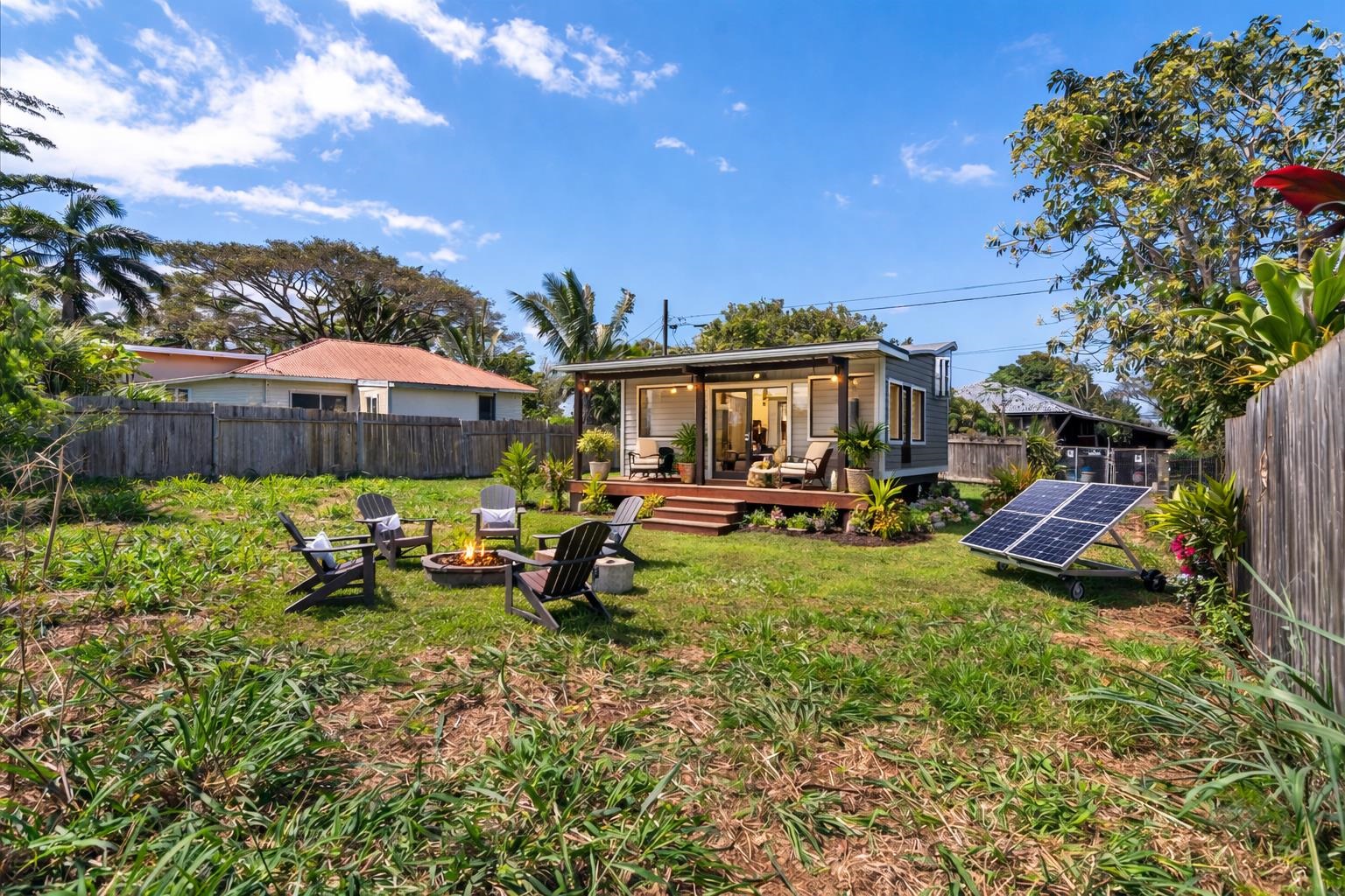 956 Kahealani Street Haiku, HI 96708 - Photo 3 of 27 a view of a house with backyard garden and sitting area