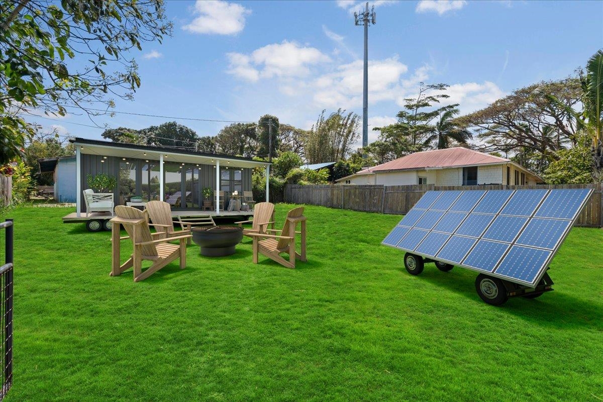 956 Kahealani Street Haiku, HI 96708 - Photo 6 of 27 a view of a house with backyard sitting area and garden