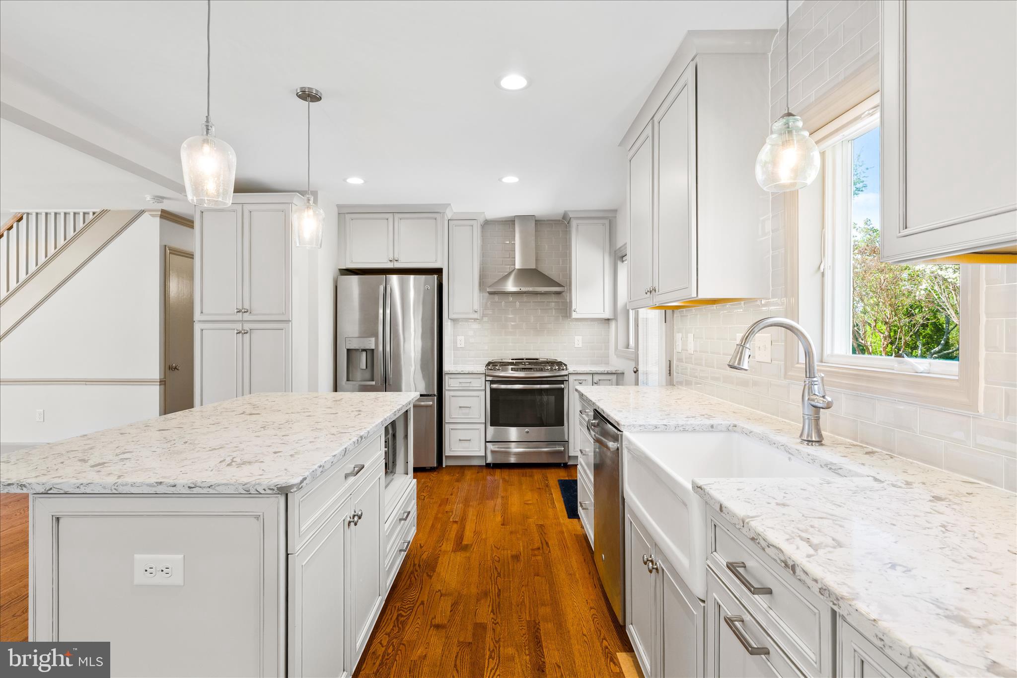 417 Biggs Avenue Frederick, MD 21702 - Photo 12 of 57 a large kitchen with stainless steel appliances granite countertop a sink a stove and a refrigerator