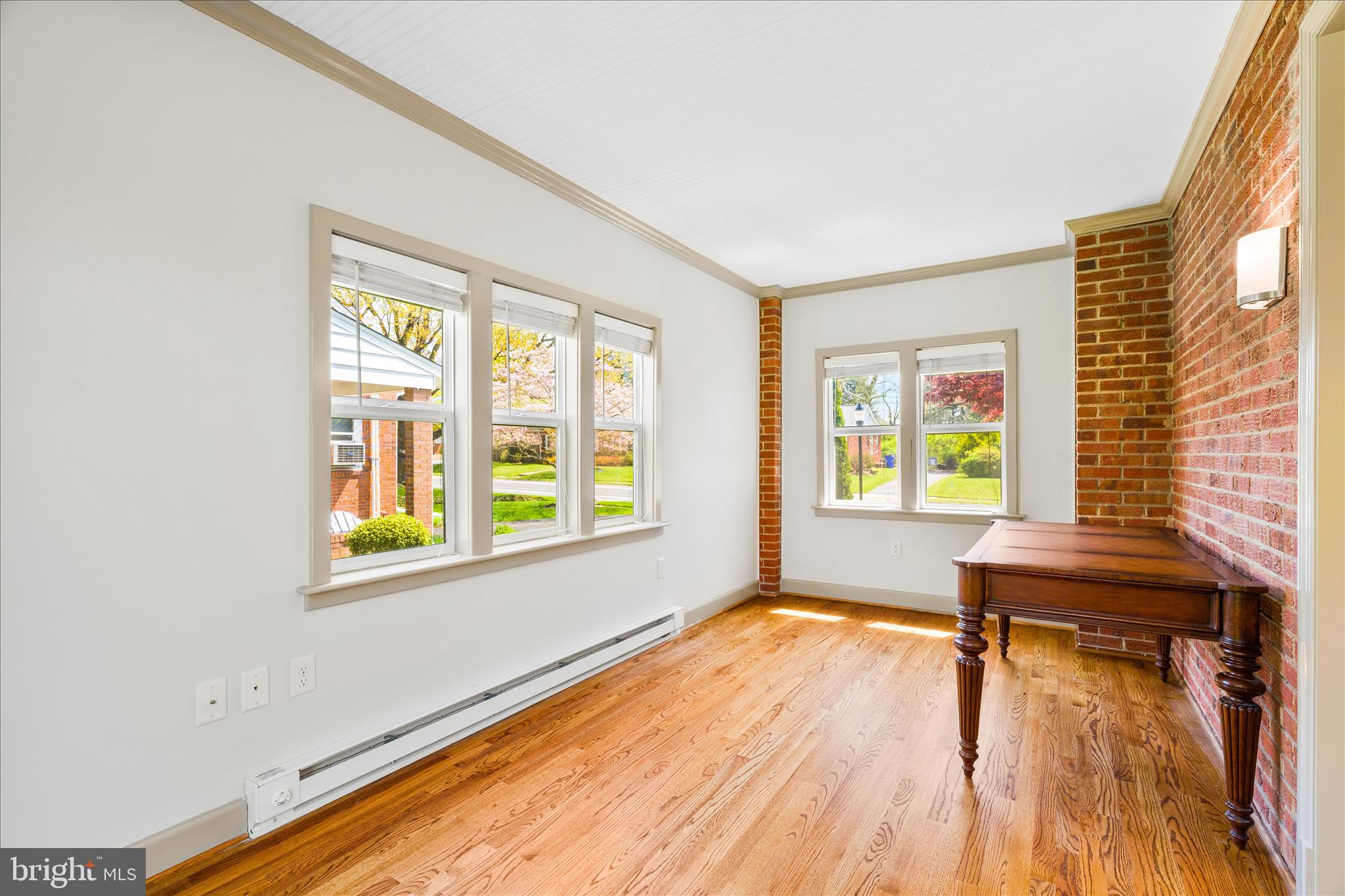 417 Biggs Avenue Frederick, MD 21702 - Photo 16 of 57 a view of an empty room with wooden floor and a window