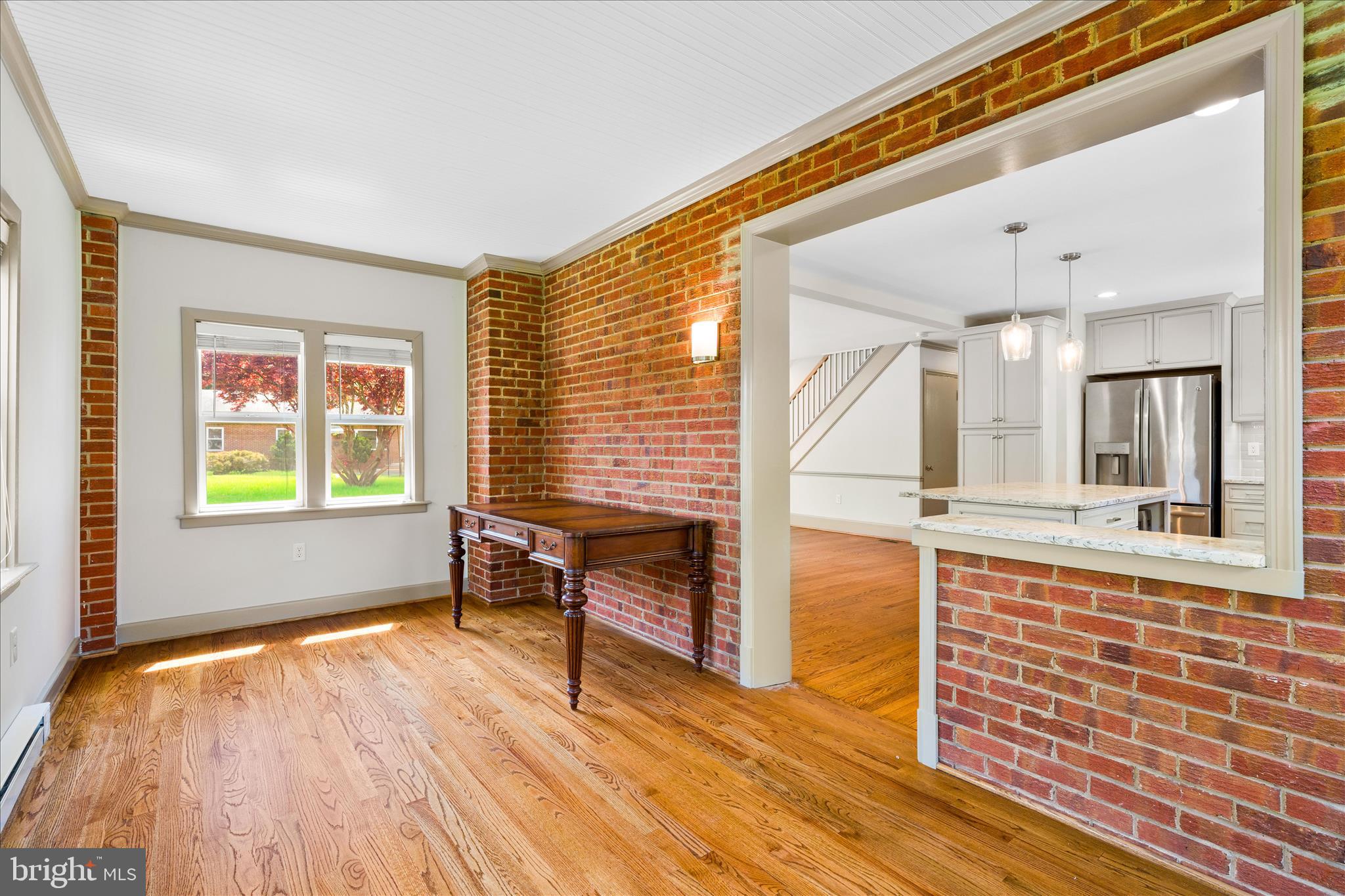 417 Biggs Avenue Frederick, MD 21702 - Photo 17 of 57 a view of kitchen with wooden floor and window