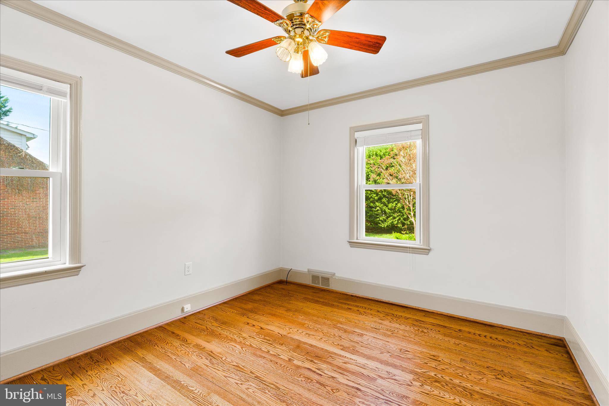 417 Biggs Avenue Frederick, MD 21702 - Photo 25 of 57 an empty room with a window and a chandelier fan