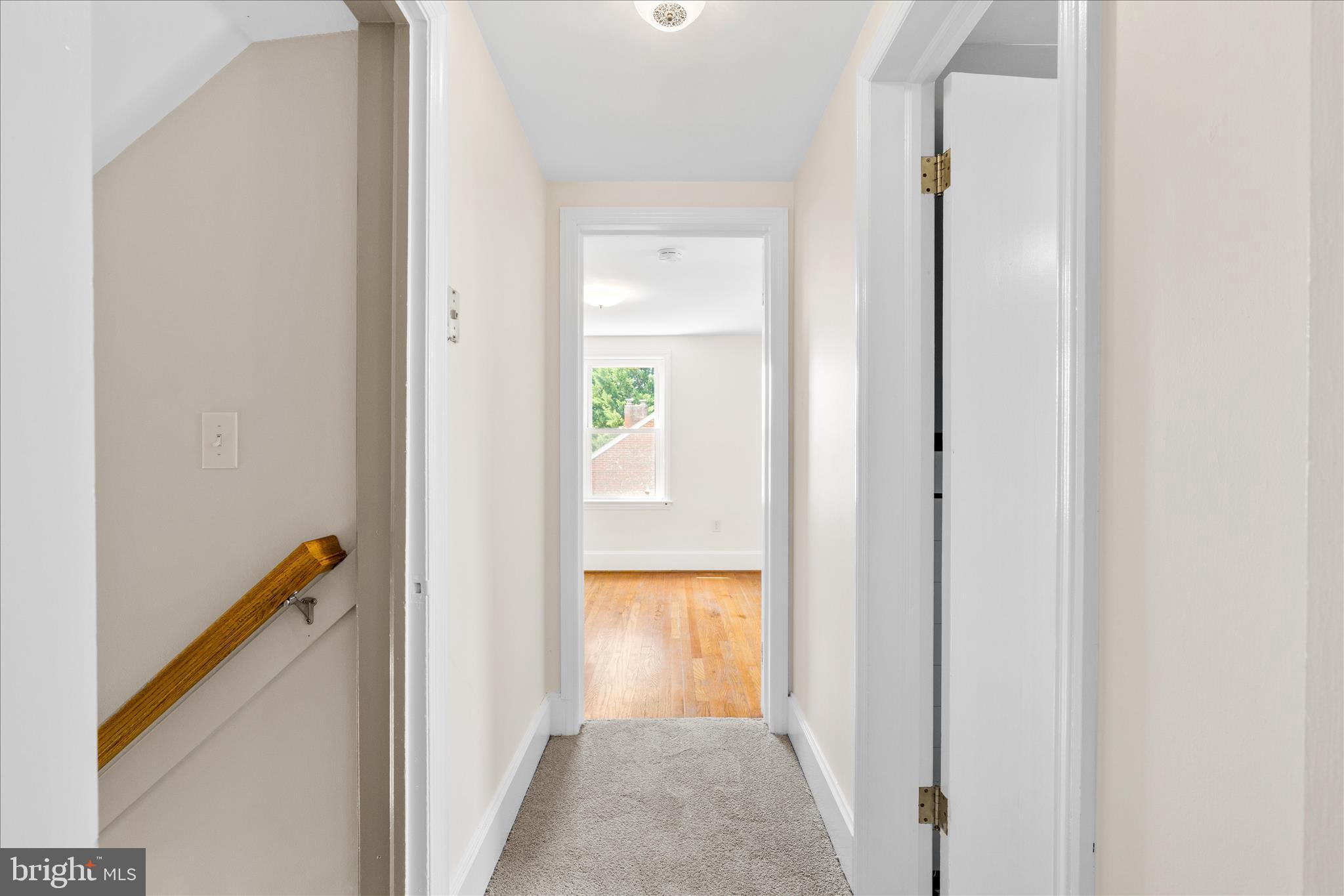 417 Biggs Avenue Frederick, MD 21702 - Photo 28 of 57 a view of a hallway with wooden floor and a bathroom