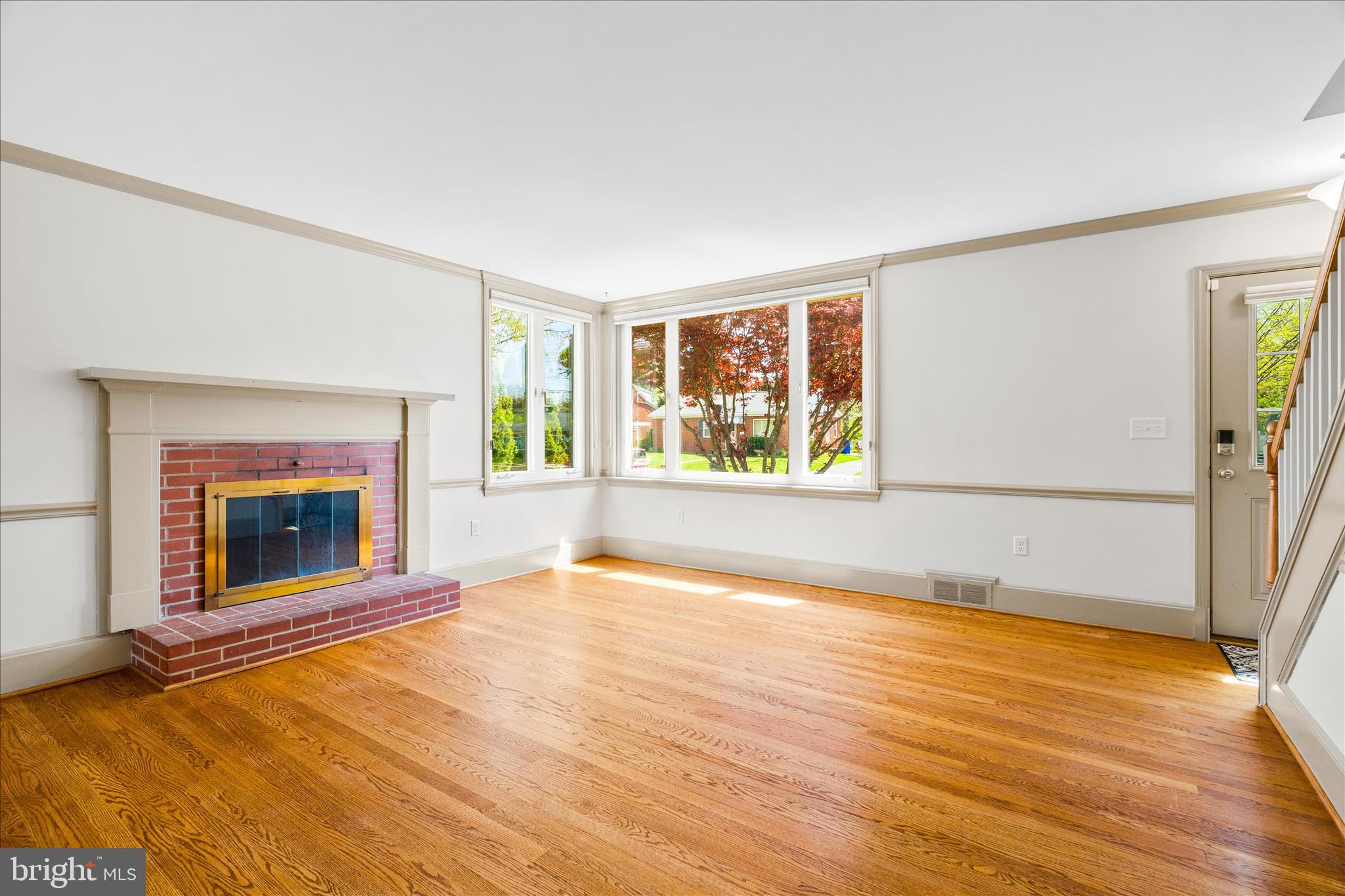 417 Biggs Avenue Frederick, MD 21702 - Photo 3 of 57 a view of an empty room with a window and fireplace