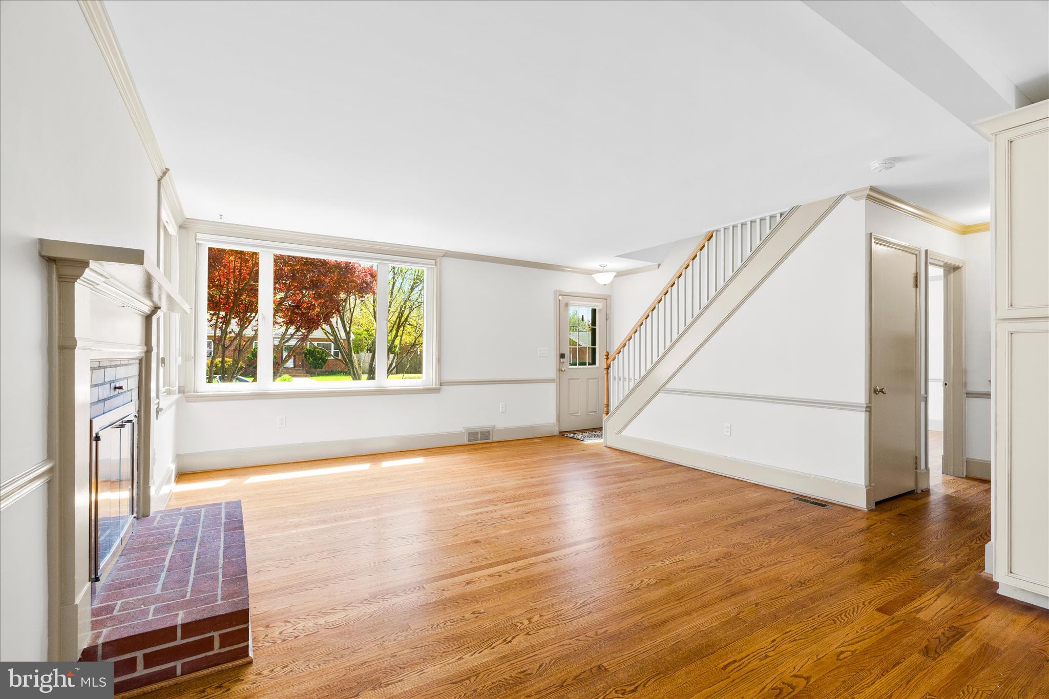 417 Biggs Avenue Frederick, MD 21702 - Photo 4 of 57 a view of an empty room with wooden floor and windows
