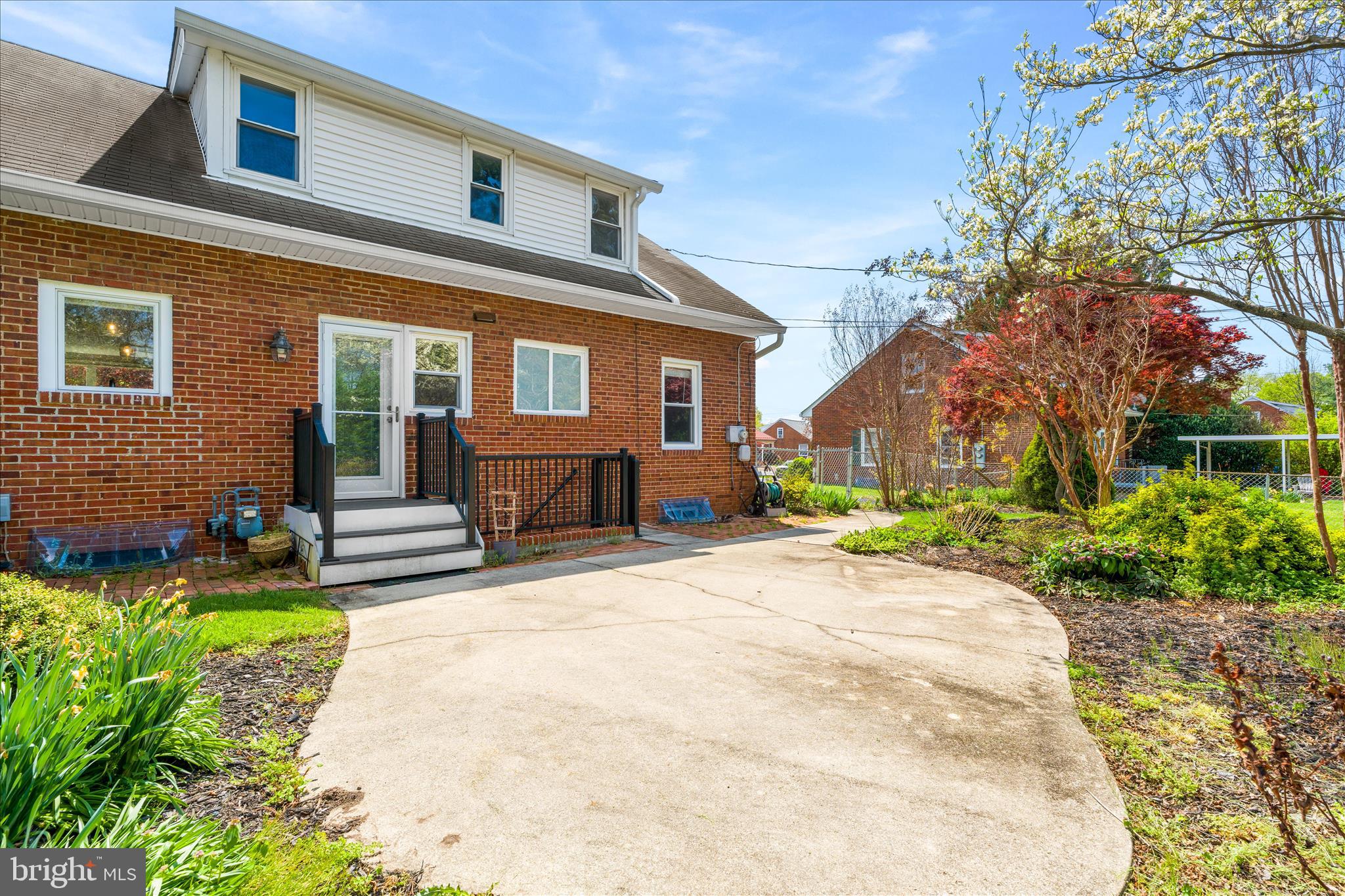 417 Biggs Avenue Frederick, MD 21702 - Photo 45 of 57 a front view of a house with a garden and patio