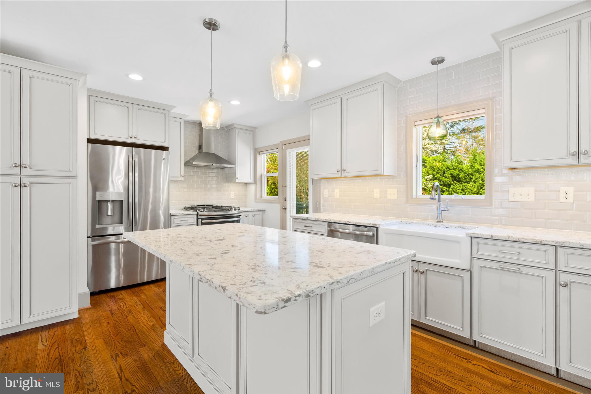 417 Biggs Avenue Frederick, MD 21702 - Photo 9 of 57 a kitchen with granite countertop a sink a center island and stainless steel appliances