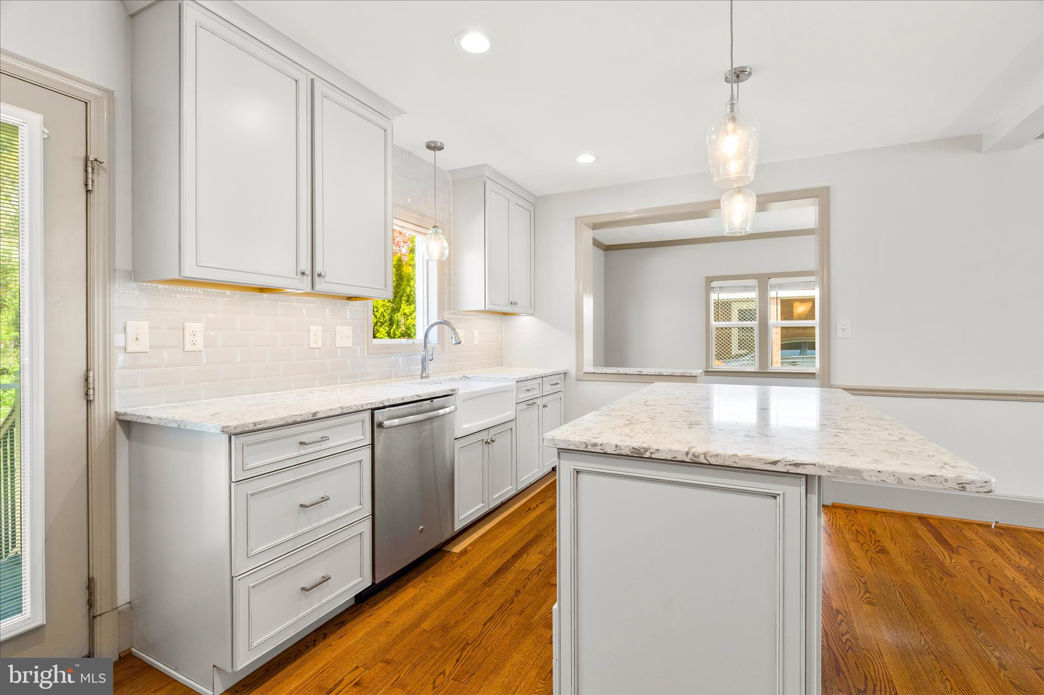 417 Biggs Avenue Frederick, MD 21702 - Photo 10 of 57 a kitchen with granite countertop cabinets stainless steel appliances a sink and a window