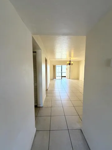 a view of a hallway with an empty room